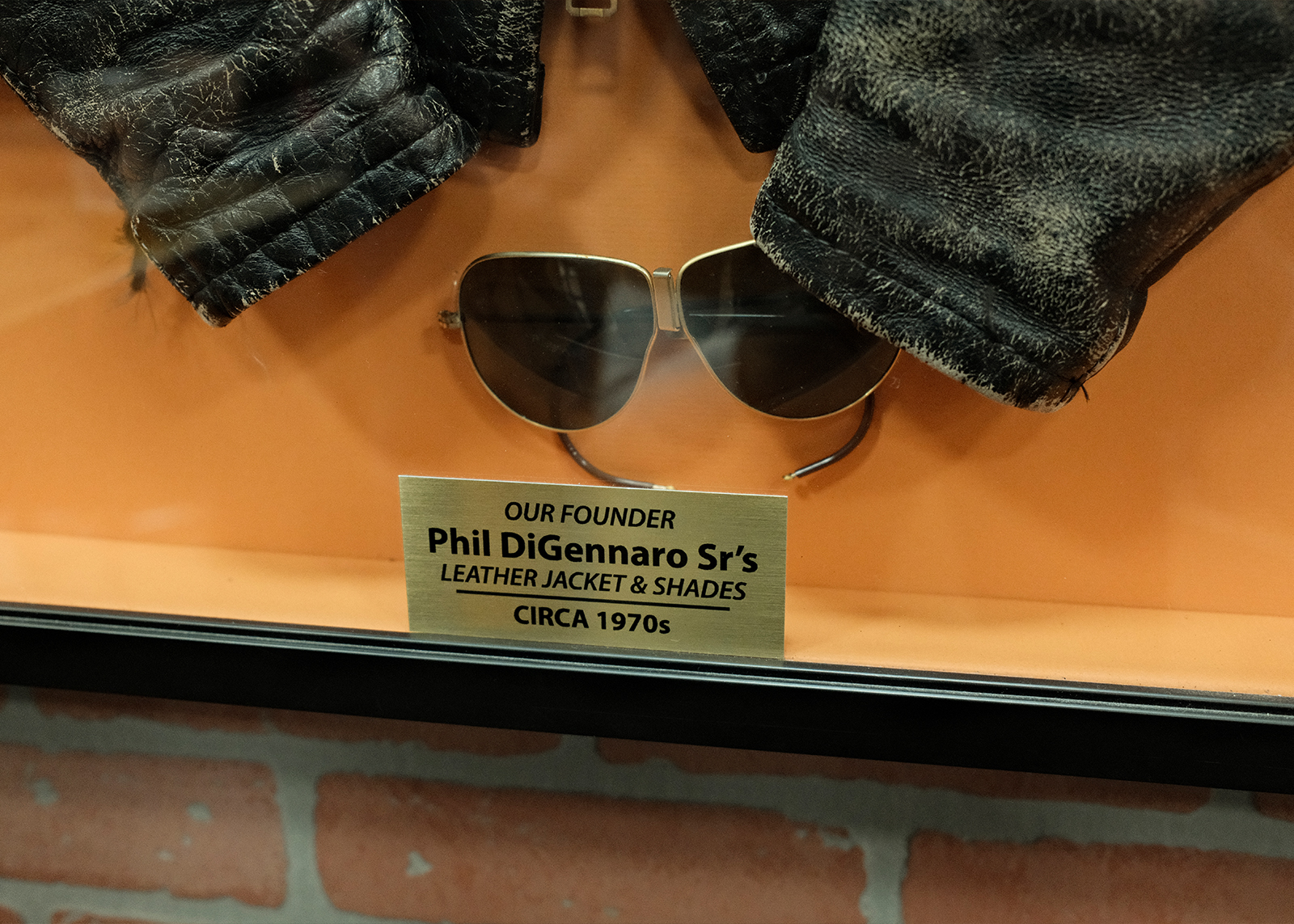 Vintage sunglasses labeled as founder Phil DiGennaro Sr.’s leather jacket and shades, circa 1970s.