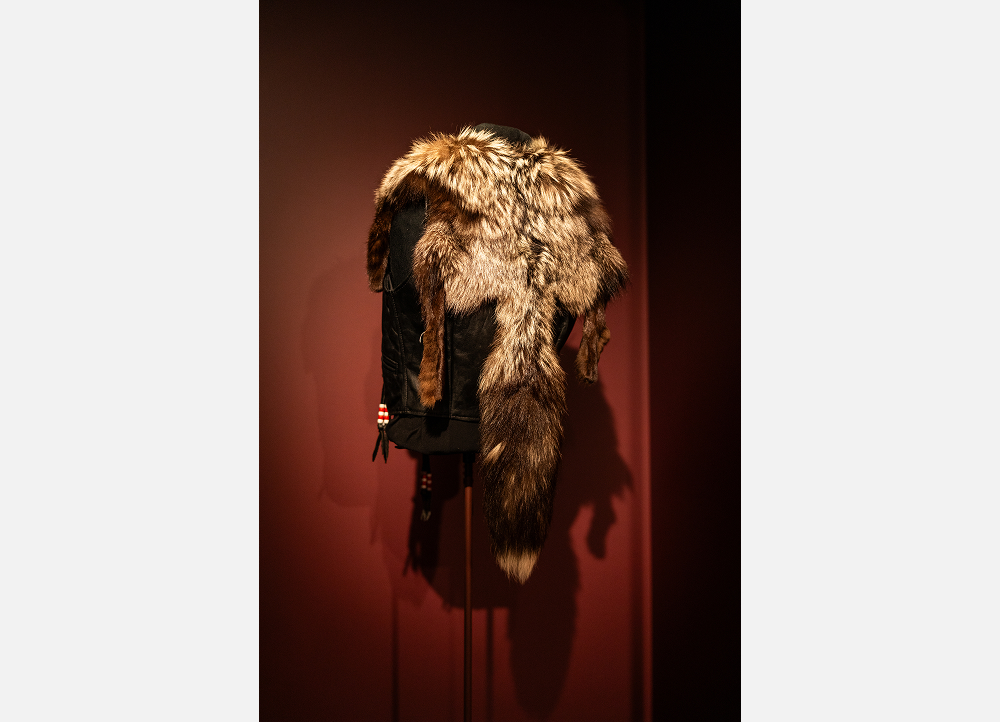 Rear view of Gail Anderson’s one-off vest lined with fox pelt, showing the tail and hind legs of the pelt