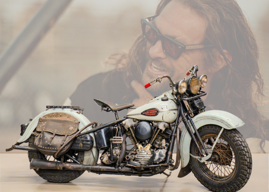 Classic white motorcycle with leather saddlebags.