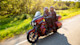 Couple riding Touring bike down the road