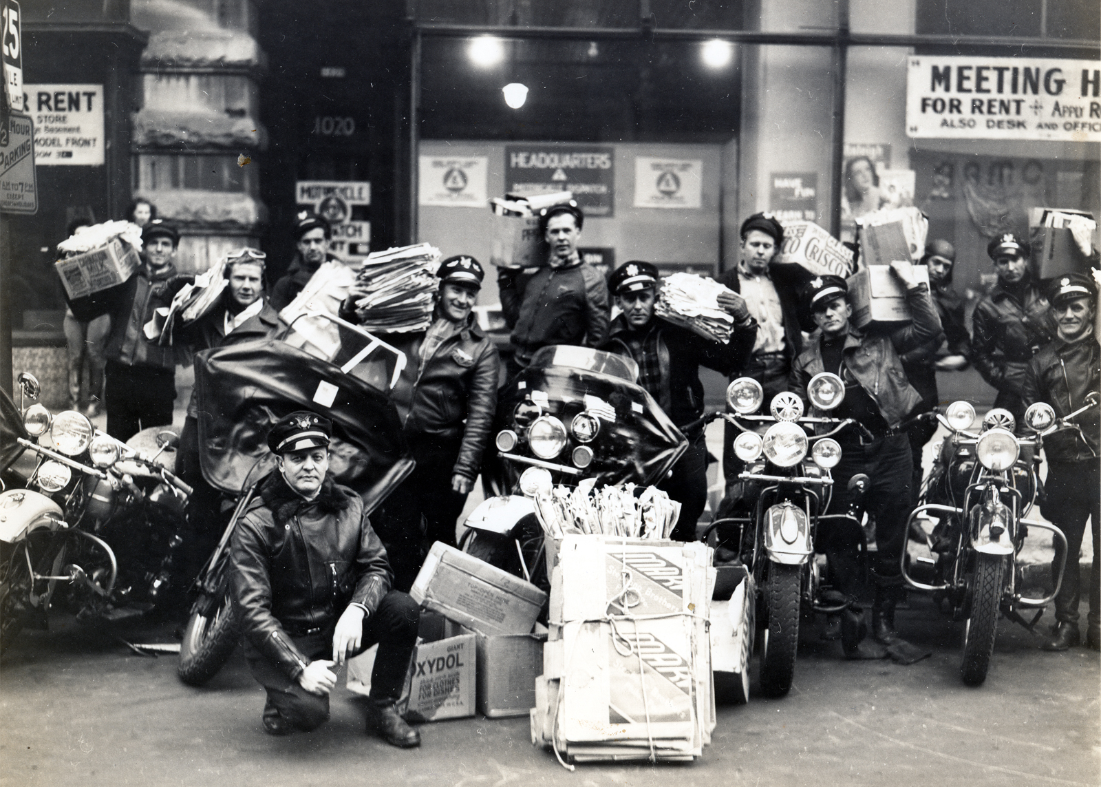 Newspapers being delivered on Harley-Davidsons