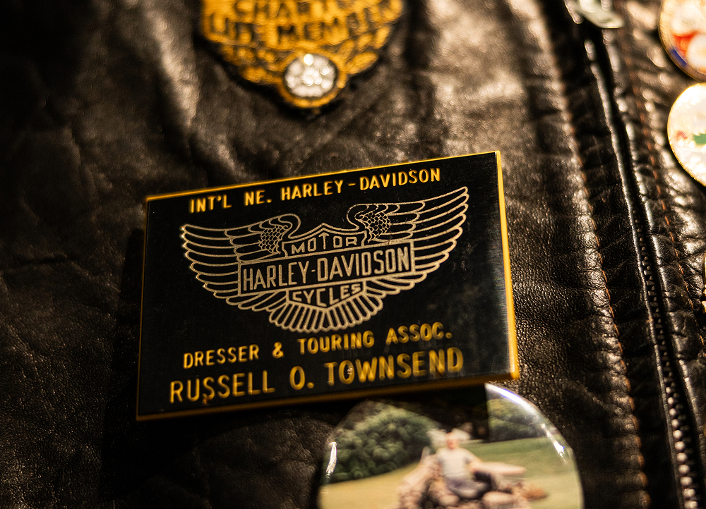 Leather vest showing a Harley‑Davidson commemorative pin belonging to Russel O. Townsend