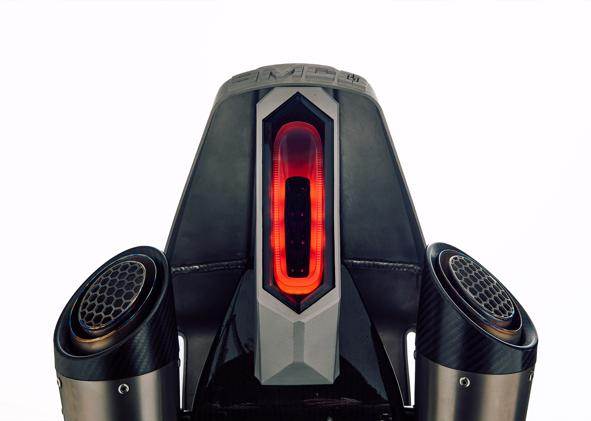 Close-up of the custom Pan America ST’s tail light with dual carbon exhaust tips and honeycomb inserts.