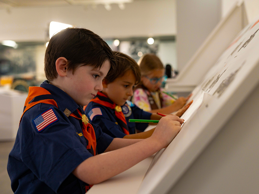 Children drawing at interactive Harley-Davidson museum activity station