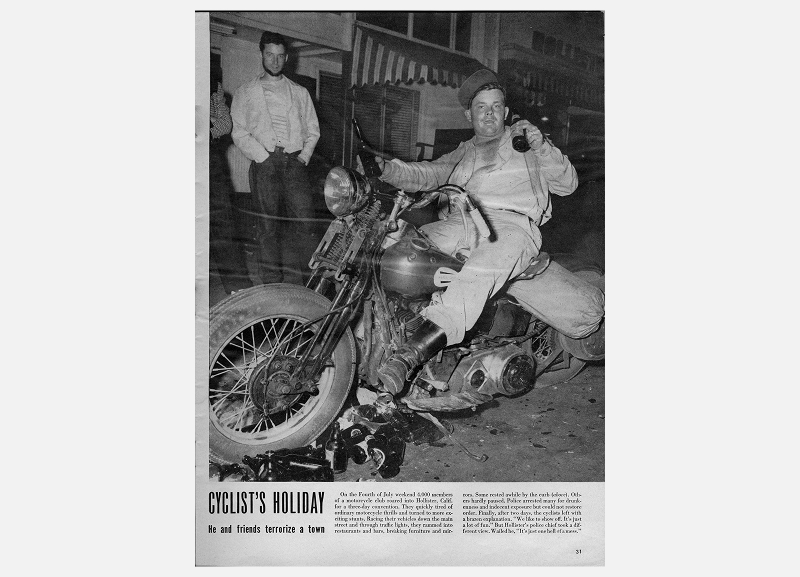 Vintage magazine page showing a drunken motorcyclist seated on a Harley-Davidson surrounded by empty beer bottles