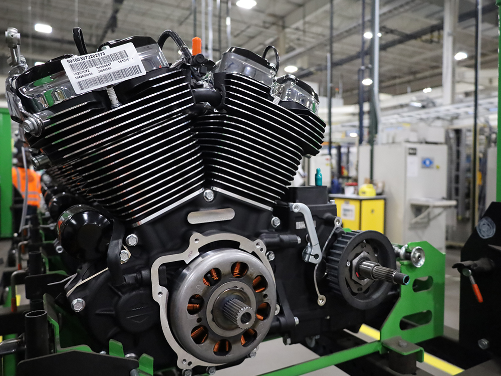 Close-up of a Harley-Davidson motorcycle engine on a factory floor