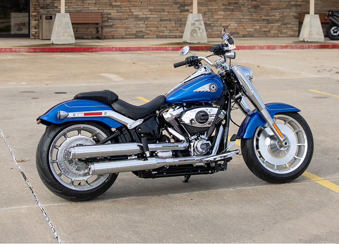 The Let’s Ride Challenge Platinum Tier prize blue 2025 Fat Boy parked in front of 3 State Harley-Davidson