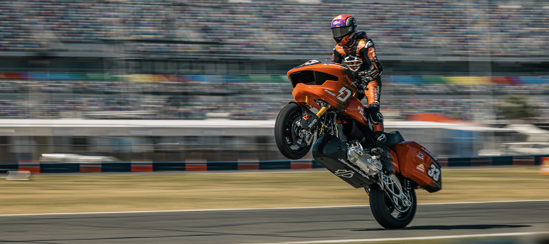 Kyle Wyman popping a wheelie on a bagger