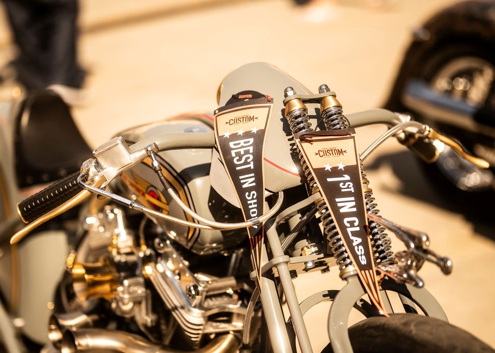Close-up view of a custom Harley-Davidson motorcycle being showcased at a dealerships exhibition.