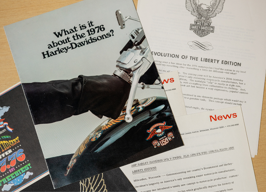 Assortment of 1976 Harley‑Davidson brochures and news sheets featuring motorcycle graphics and logos