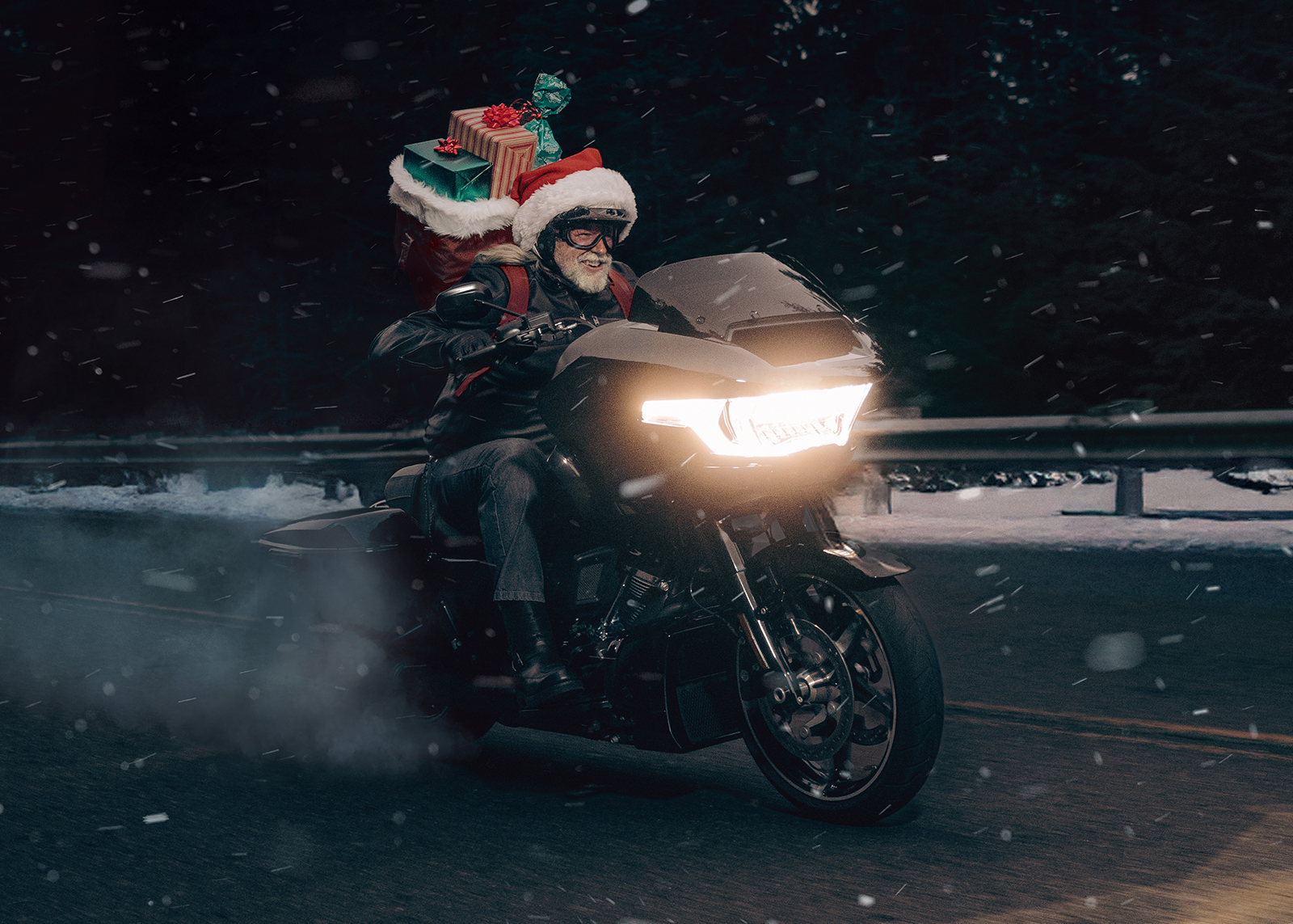 Santa with sack of presents riding a 2025 Road Glide