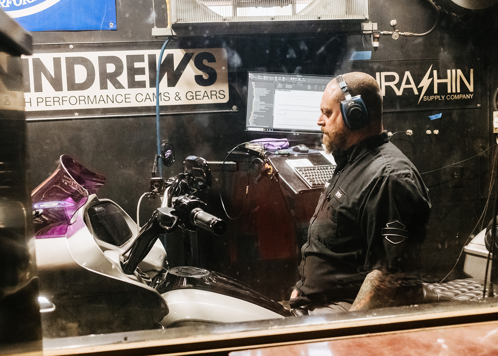 Moonshine Harley-Davidson Service and Operations Manager Mike Van Orden focuses on tuning a motorcycle in Moonshine’s soundproof dyno room.