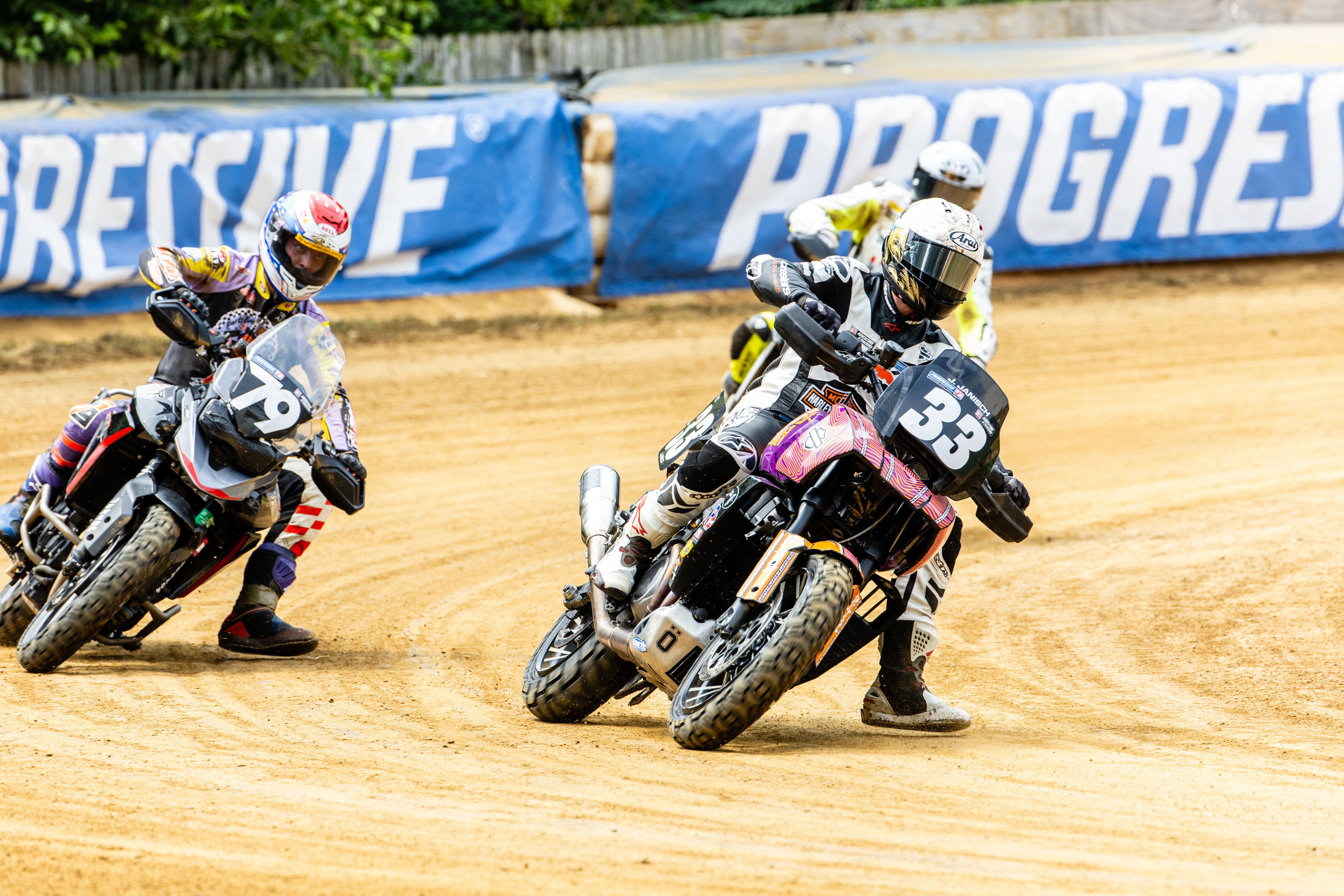 two Pan Americas racing on flat track
