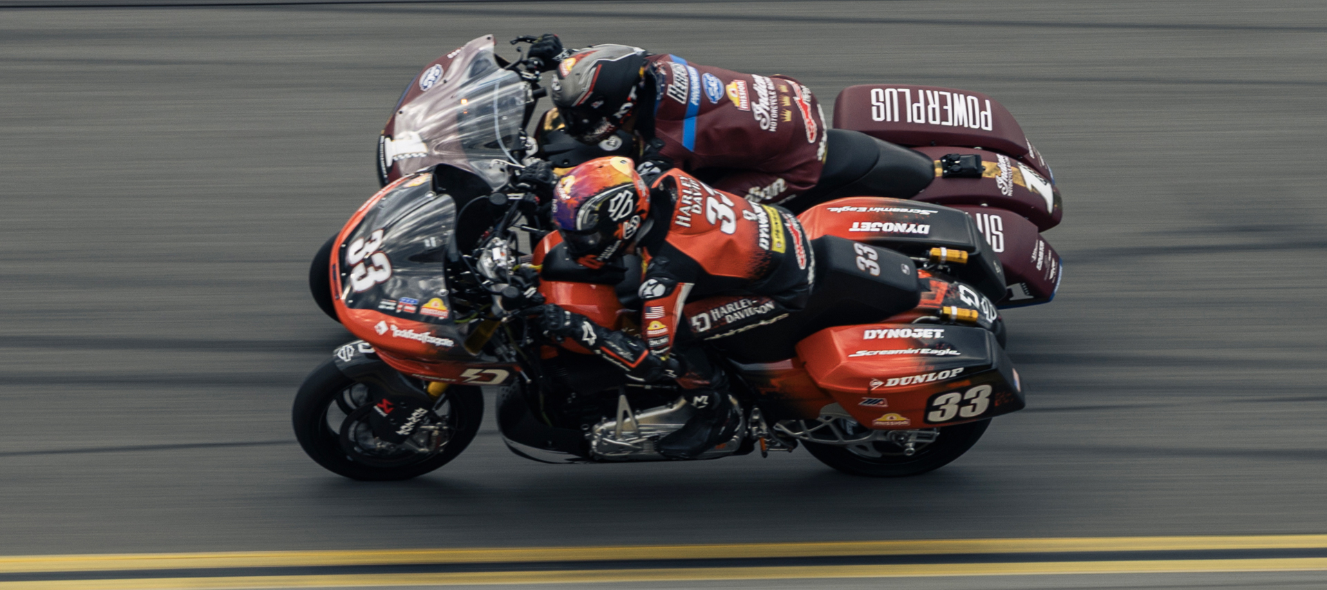 Kyle Wyman and Troy Herfoss battle for position on the high banks of Daytona International Speedway, riding elbow to elbow