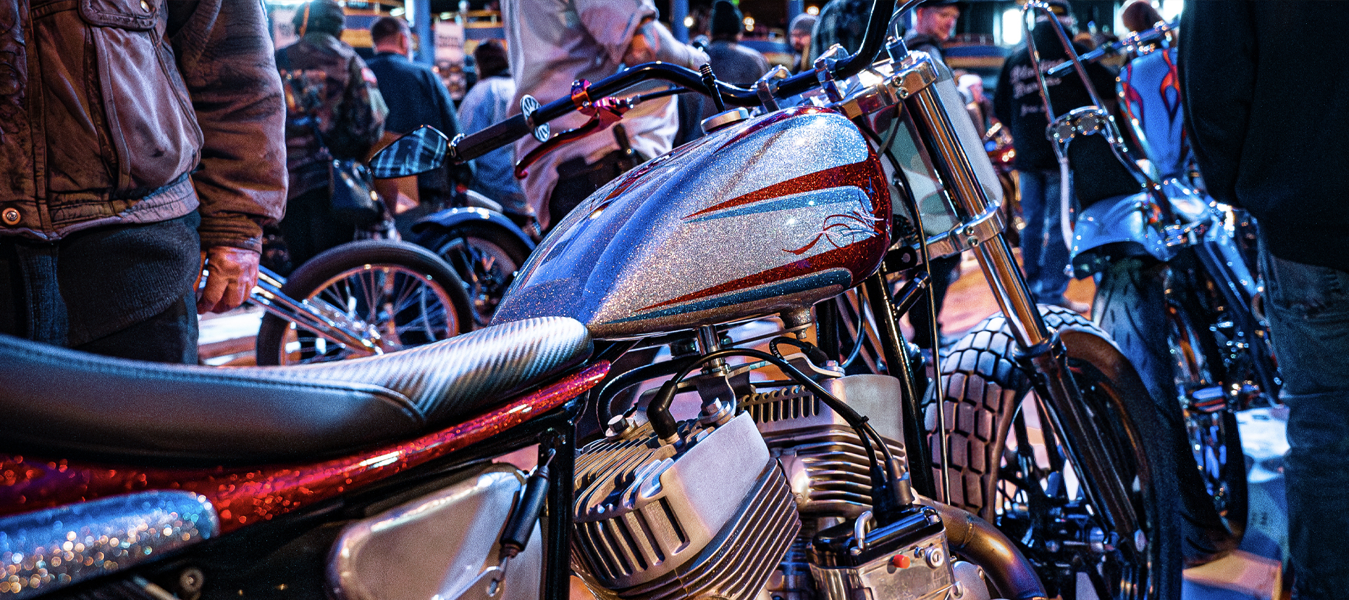 A customized flathead motorcycle on the showroom floor