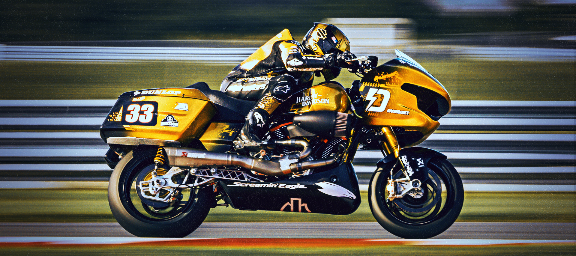 Kyle Wyman speeds past on his champion gold Harley-Davidson race bike during the final race of the King Of The Baggers season.