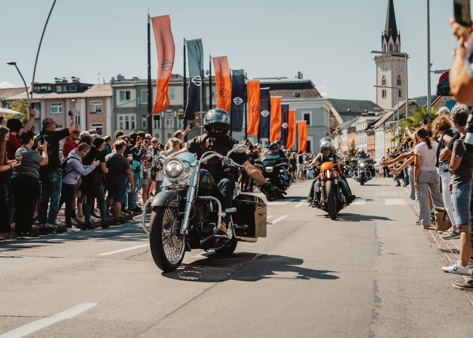 People cheering and taking photos at European Spring Rally