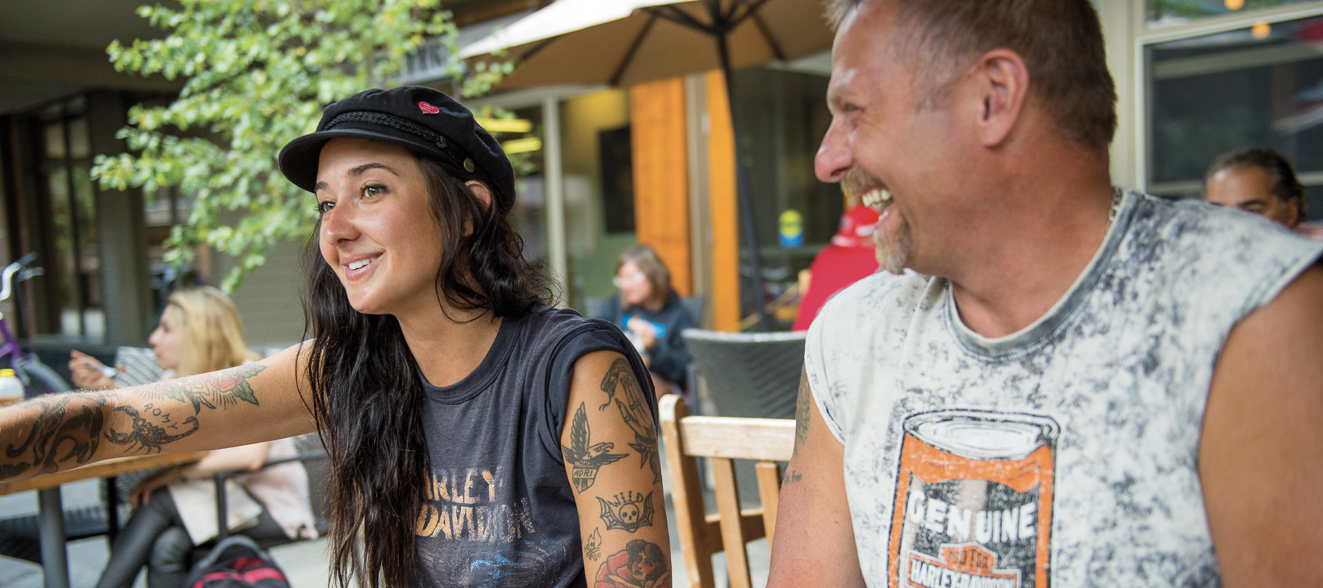Man and woman sitting together smiling, portrait