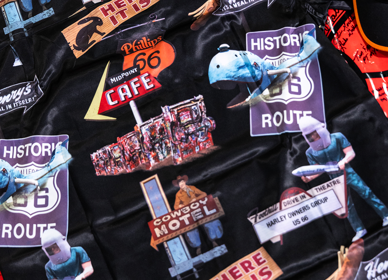 Detail of commemorative black t-shirt with collage of Route 66 themed graphics