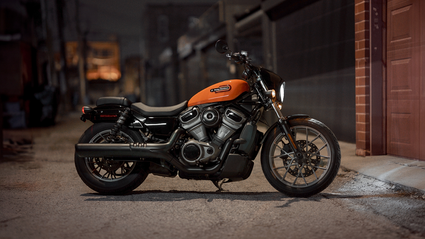 Nightster Special in Baja Orange parked outside of garage