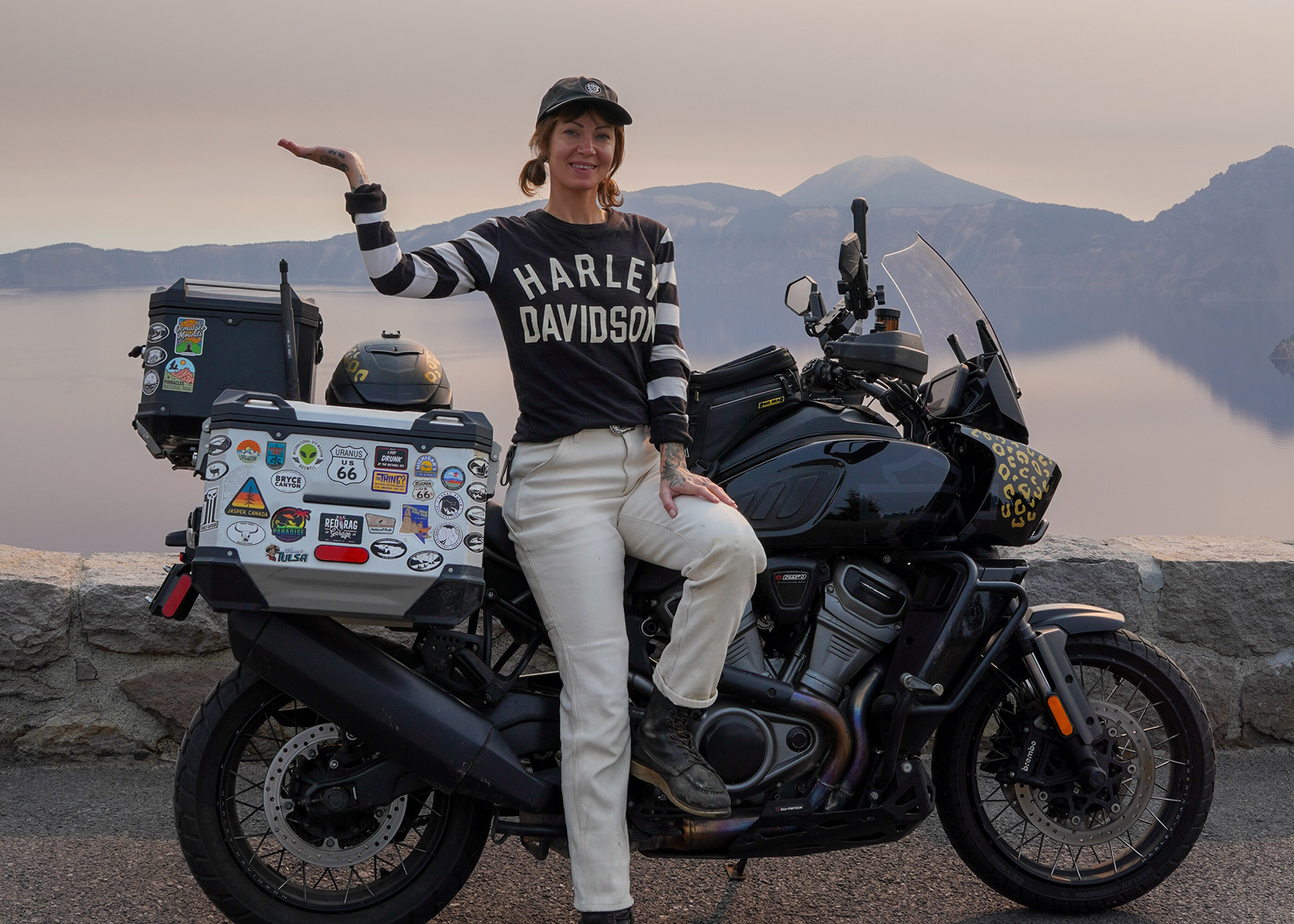The author Sanna Boman standing next to her Harley-Davidson Pan America at Crater Lake in Oregon.