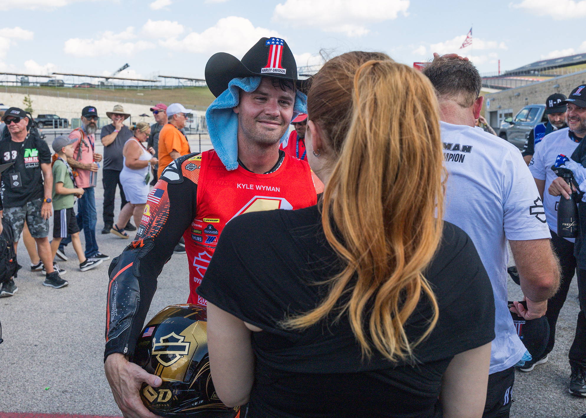 Kyle Wyman greets his wife Hannah after winning the 2025 King Of The Baggers championship.
