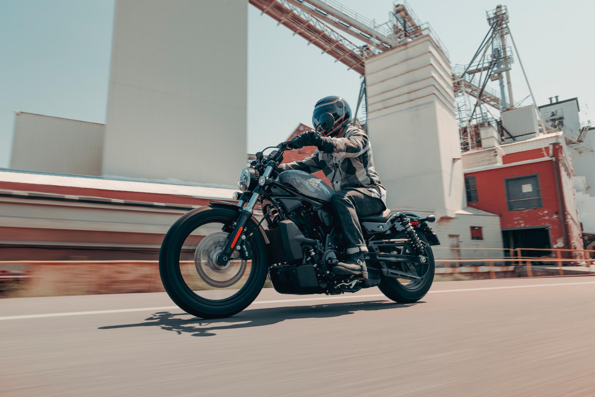 Motorcyclist rides a Nightster near a factory 