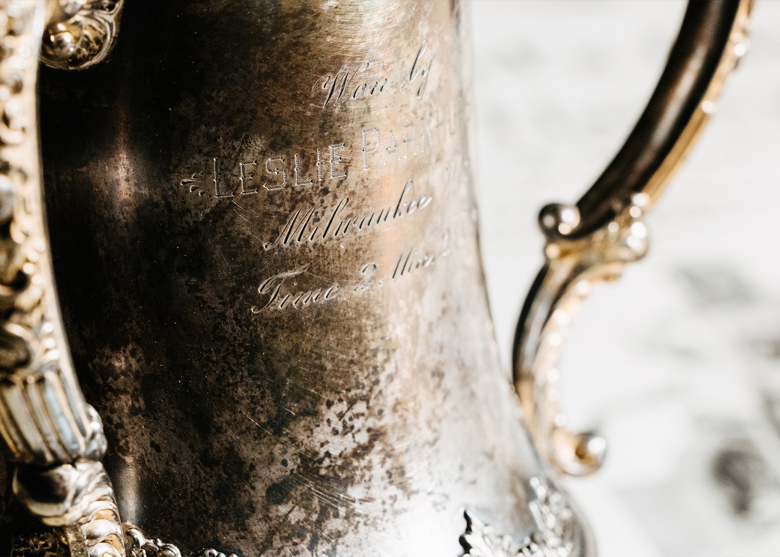 A close-up of Red’s silver-plated loving cup style trophy from the 150-mile race at Oklahoma City, April 20th, 1915, where he had the fastest lap and won the race.