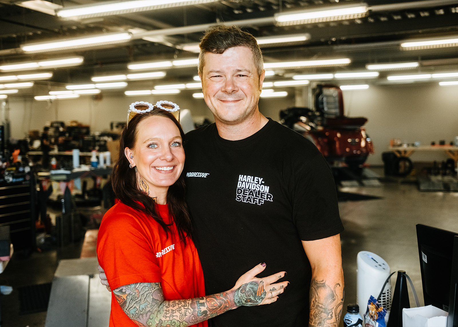 Smiling staff pose together inside Black Hills Harley-Davidson.