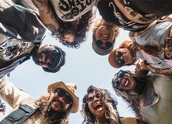 people looking down at camera in a circle