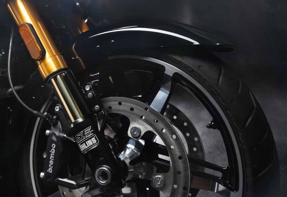 motorcycle front wheel showing shock and rotor