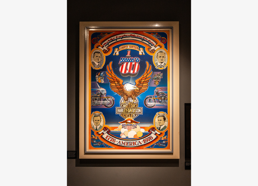 Framed Harley-Davidson Bicentennial poster featuring eagle artwork, Number One logo, and heritage motifs