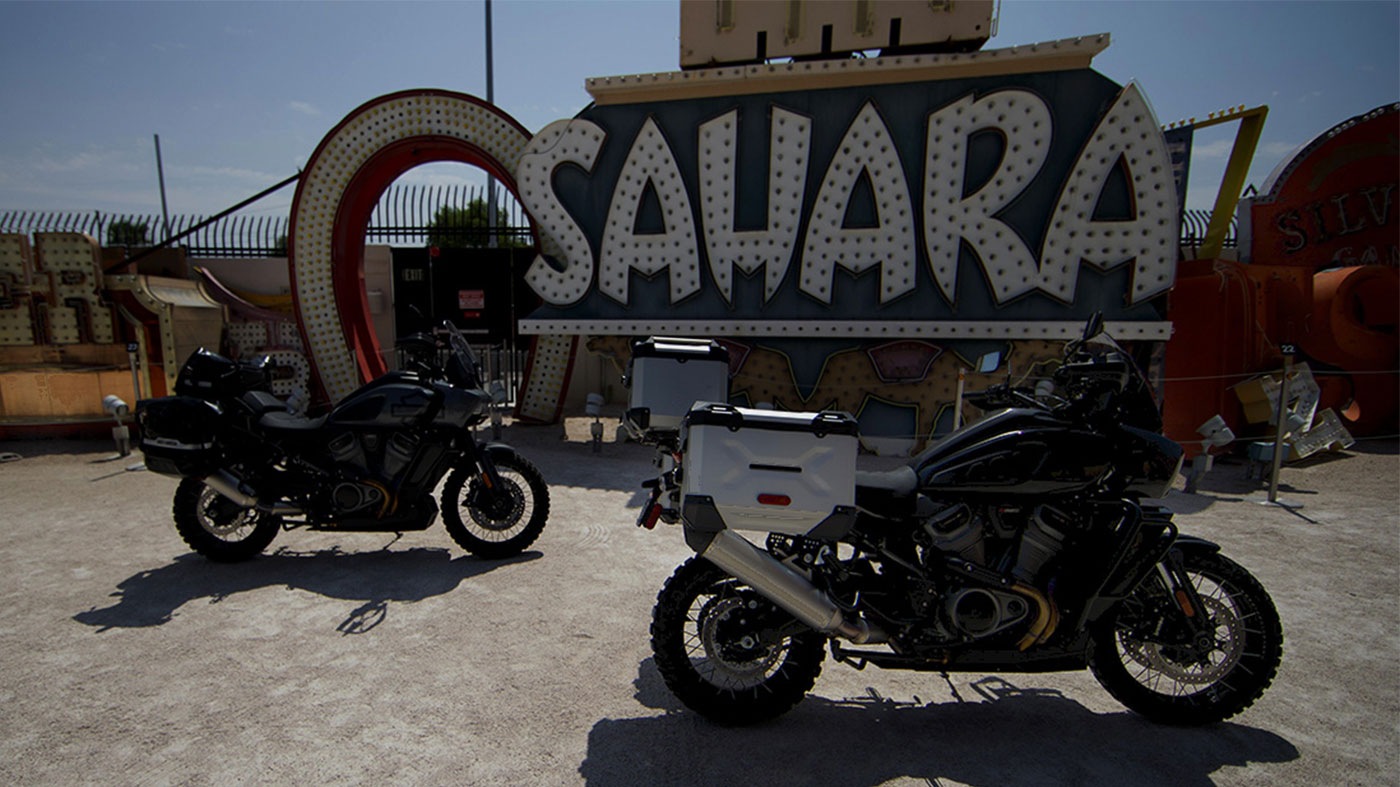parked motorcycles by Las Vegas sign