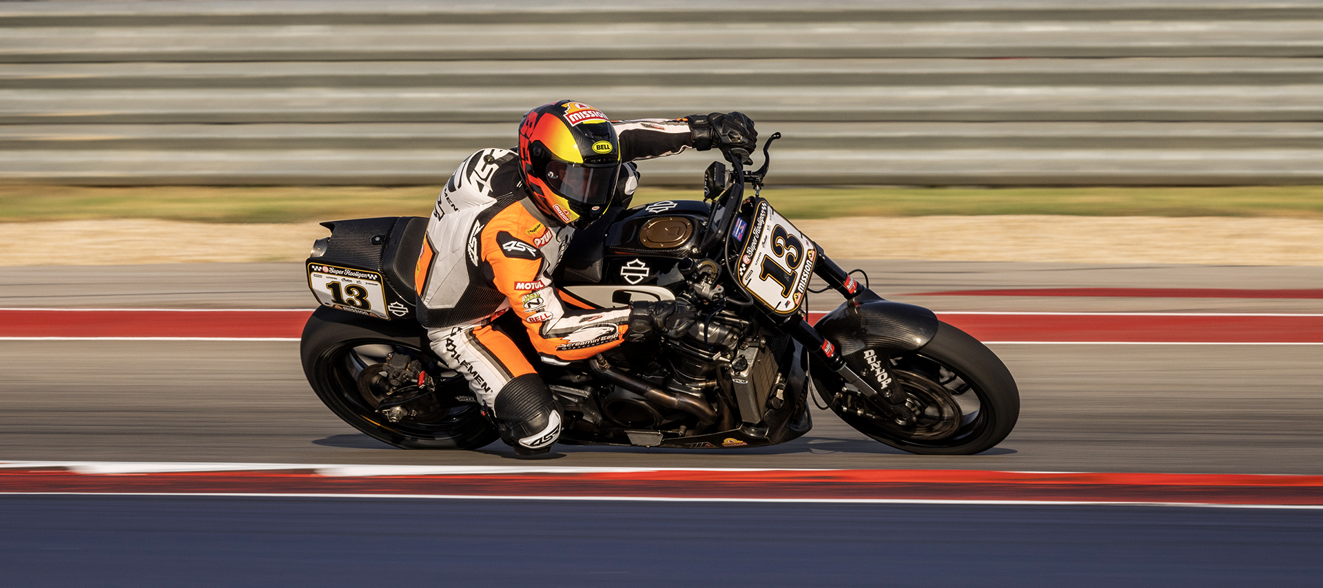 Cory West rides his Super Hooligan H-D Pan America deep into a corner on a racetrack