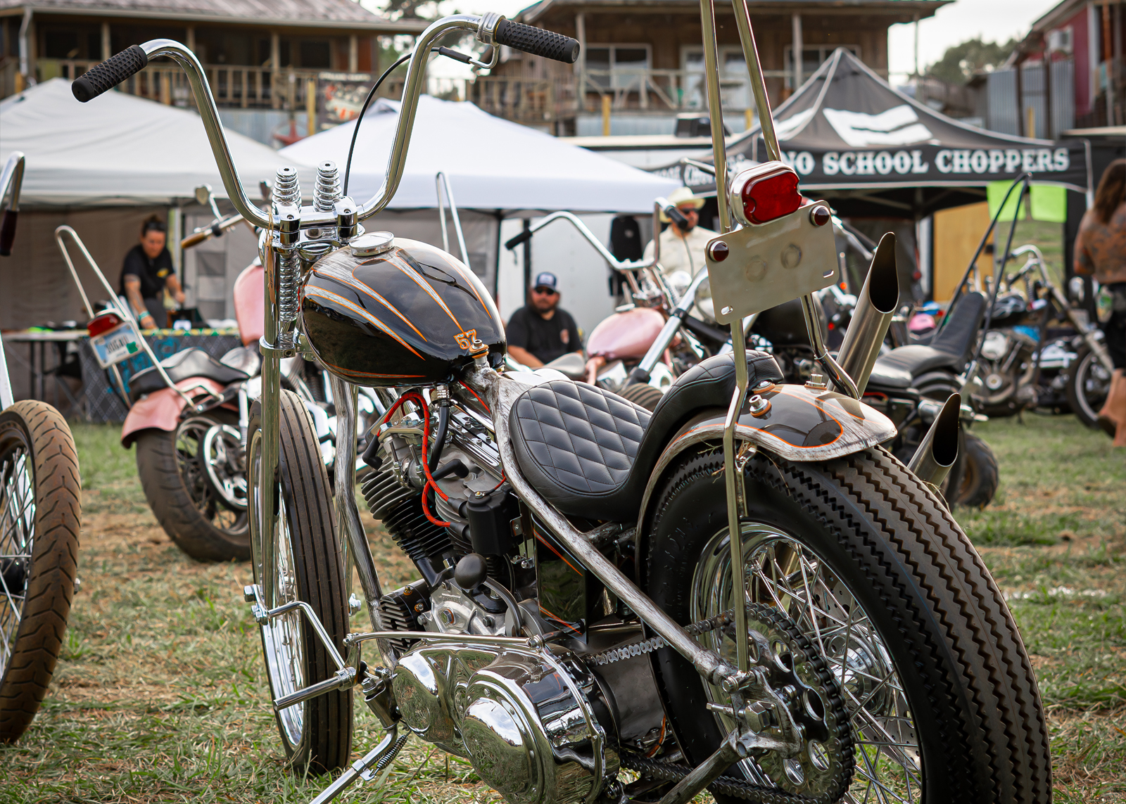 Close up of a black and orange Harley