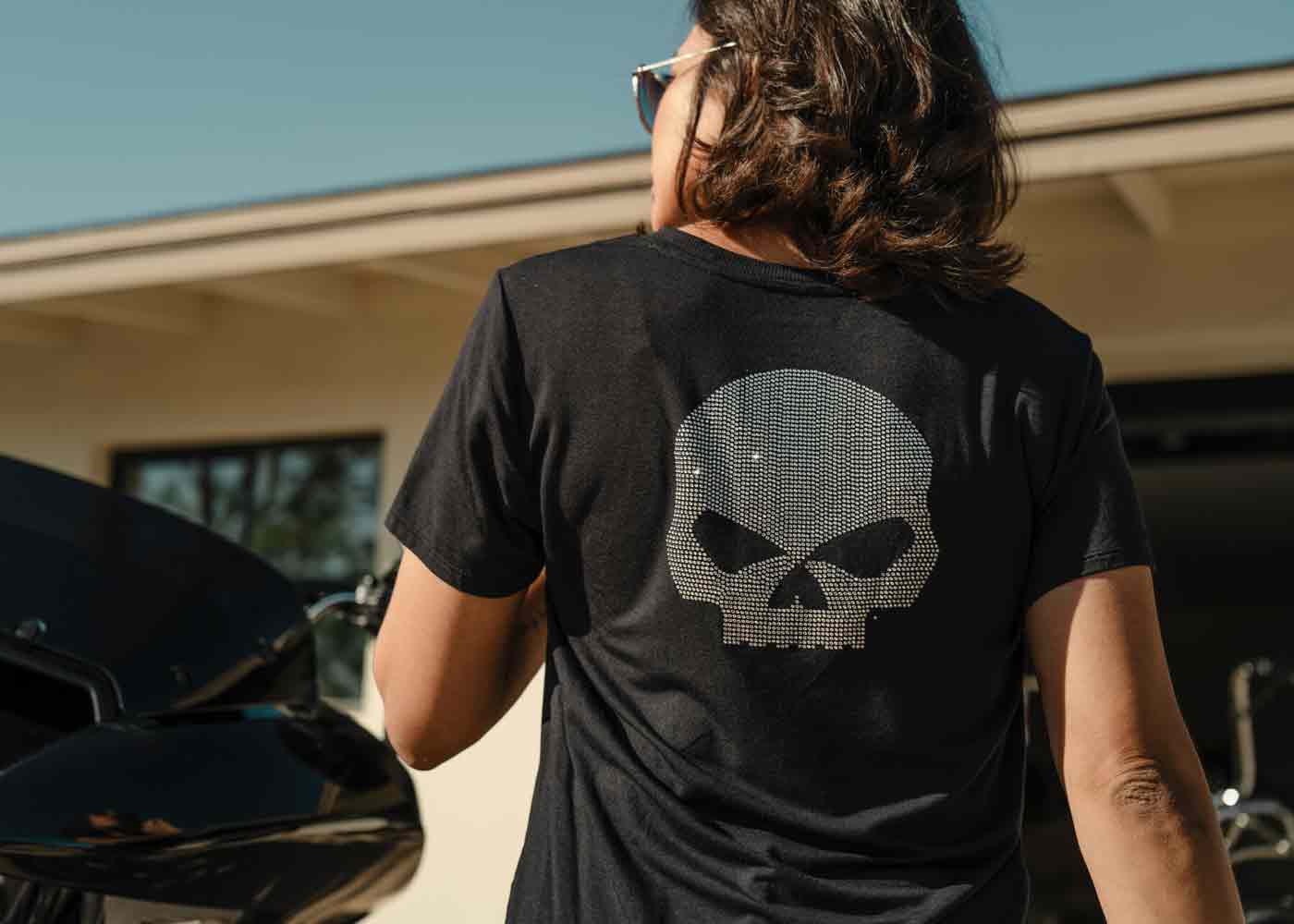 woman wearing a willie g skull tee