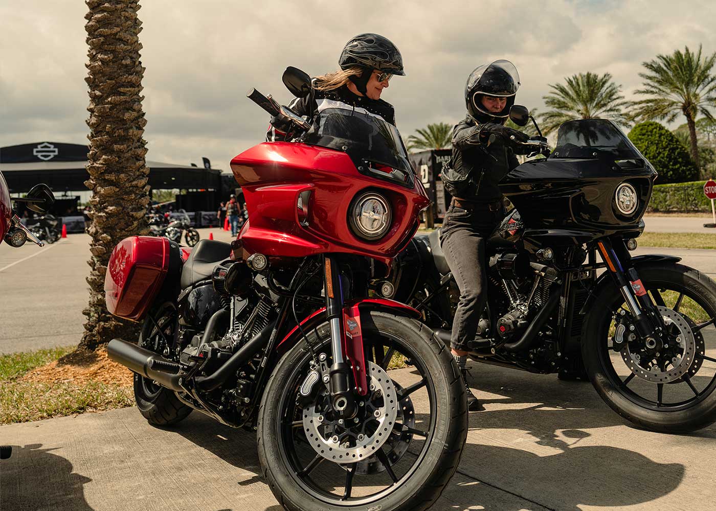 two-motorcycles-one-red-one-black-parked-side-by-side-ls