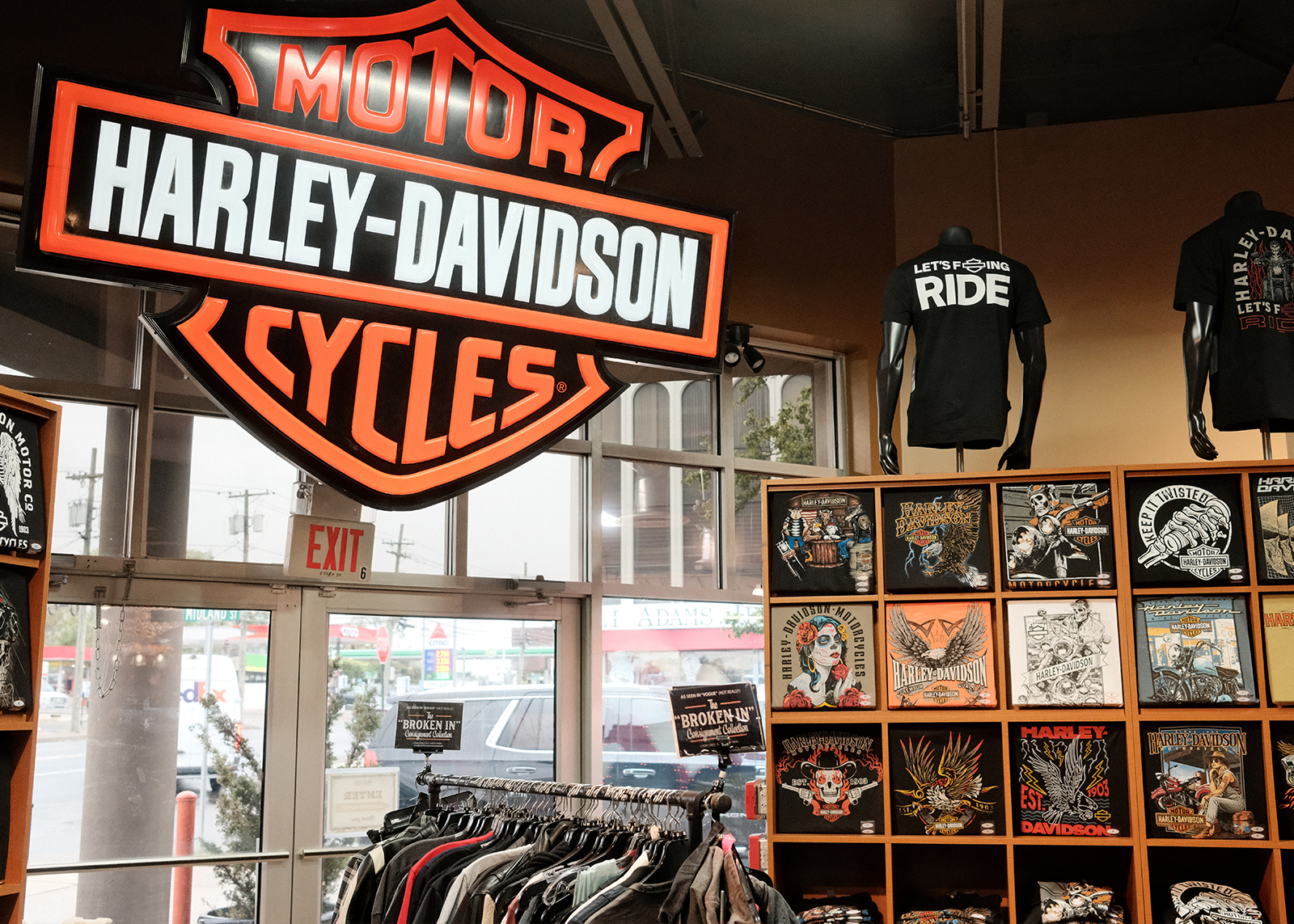 The interior of Bergen H-D with a large Harley-Davidson bar and shield sign and rows of motor apparel.