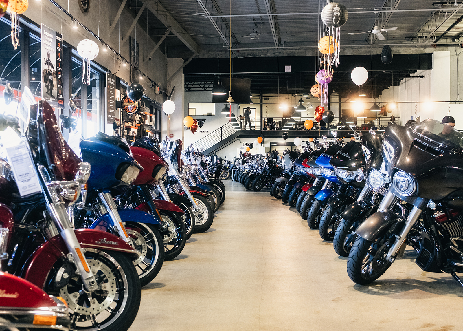 The interior showroom of Harley-Davidson of Nassau County with rows of motorcycles on display.
