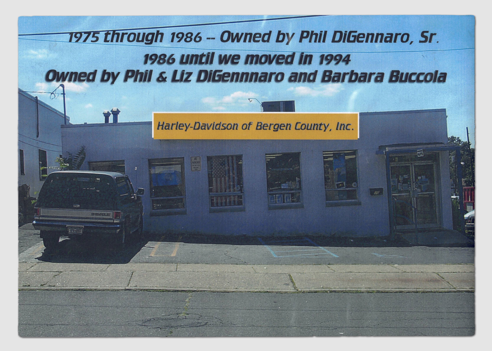 Older Harley-Davidson Bergen County building exterior with ownership years printed on the photo.