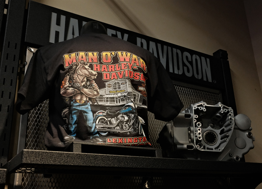 Man O’ War Harley-Davidson T-shirt display featuring custom artwork and dealership branding
