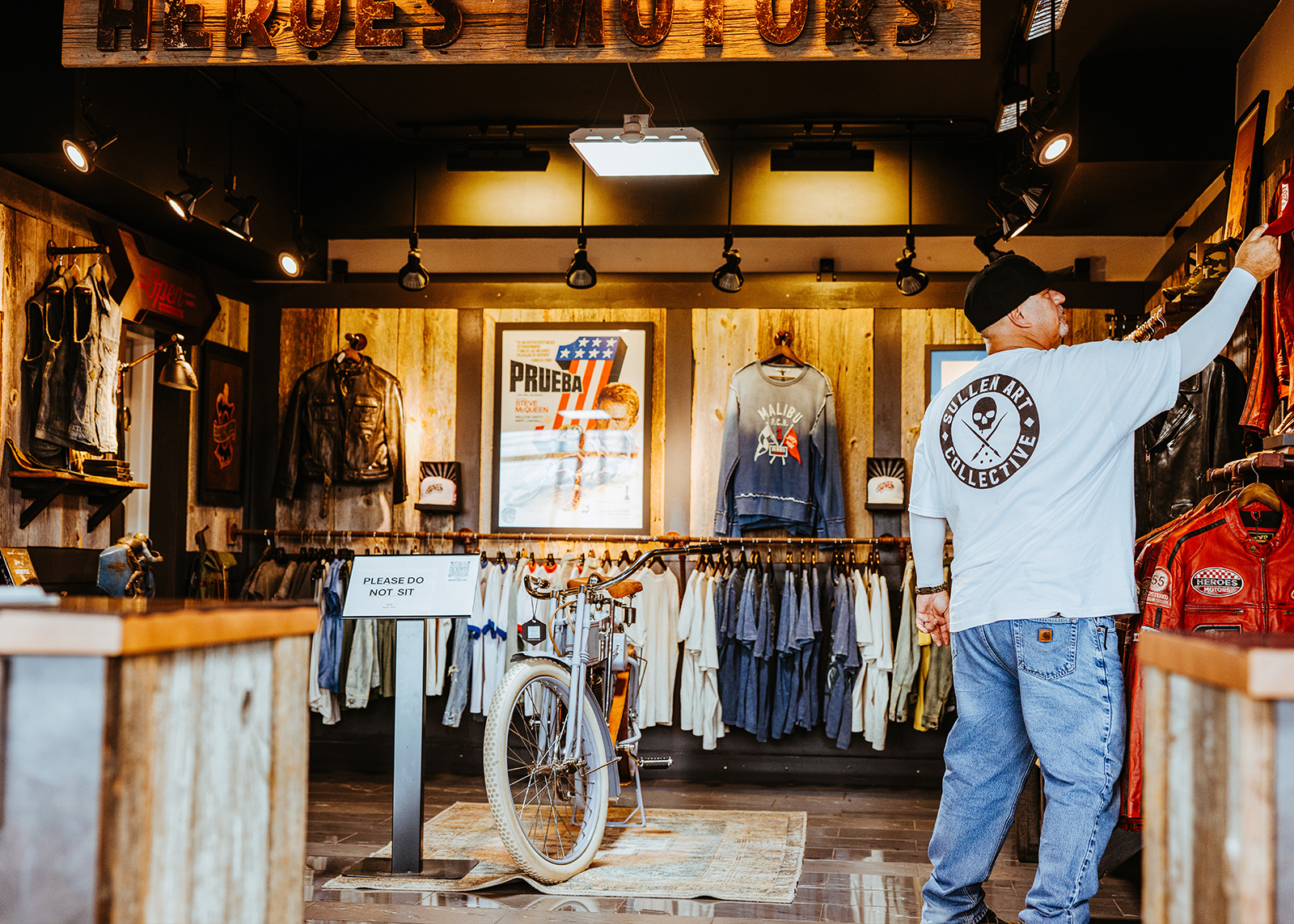 A customer shops the Heroes Motors display at Bartel’s Harley-Davidson.