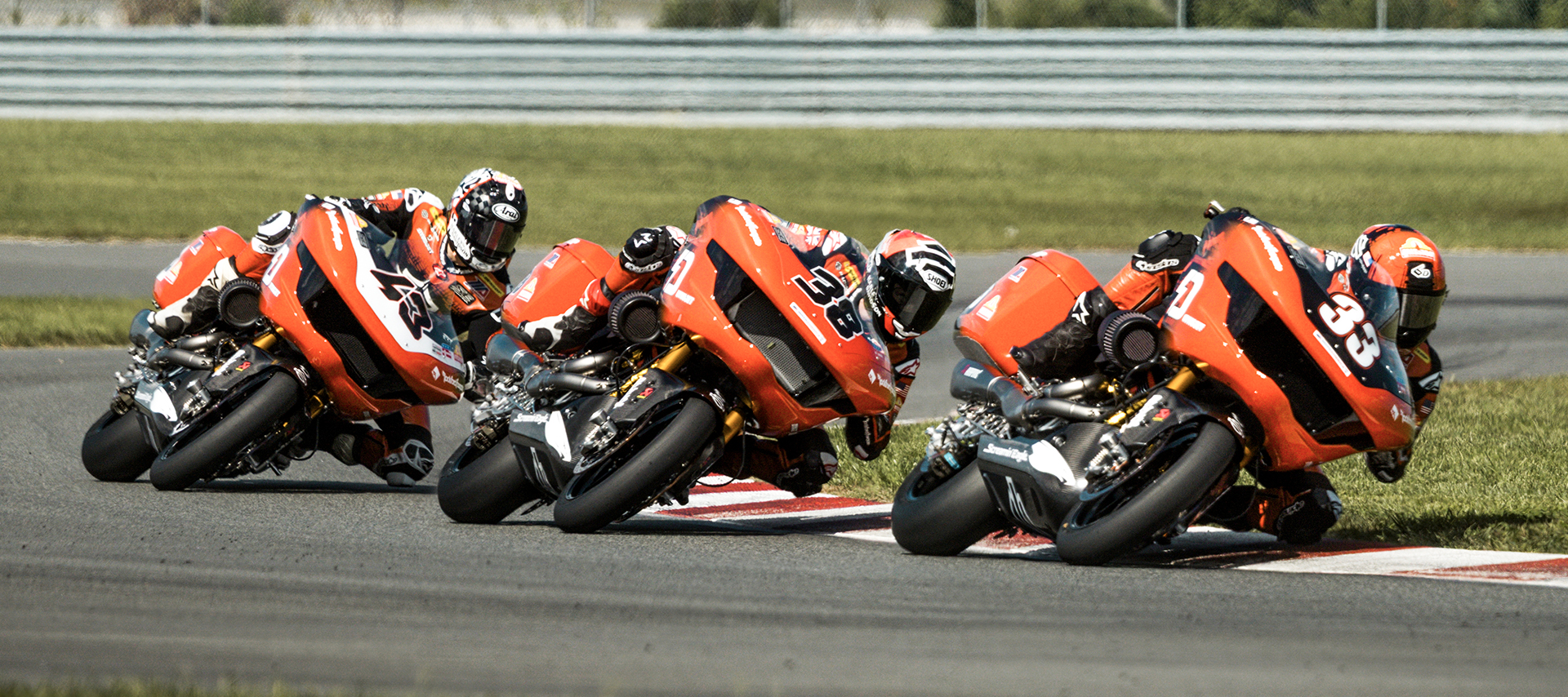 Kyle Wyman, Bradley Smith, and James Rispoli all lean through a corner one right after another during a King of the Baggers race.