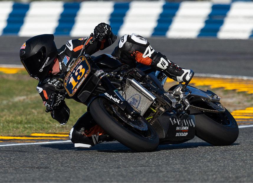Corey West leans through a corner during a Super Hooligan race at Daytona International Speedway