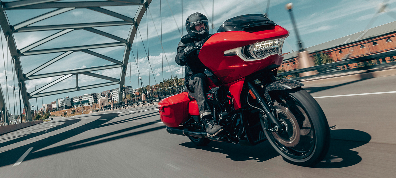 A dynamic angle of a Harley-Davidson CVO Road Glide ST being ridden across a bridge.
