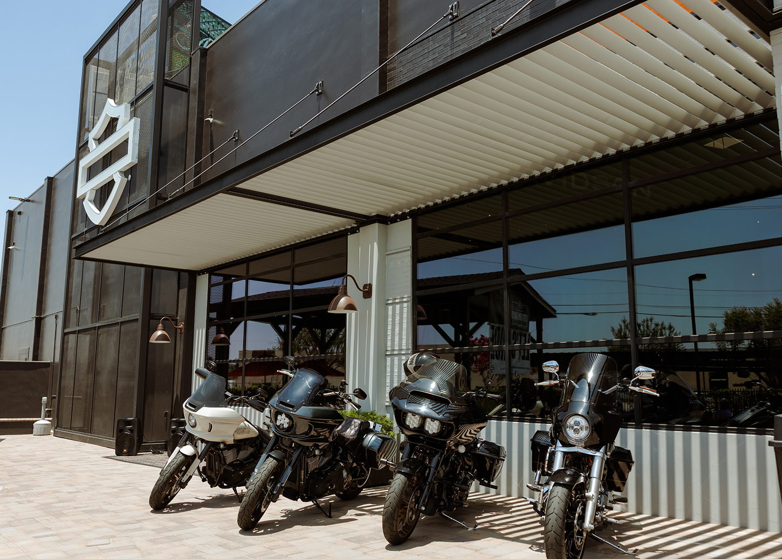 Four motorcycles parked out front of Laidlaw’s Harley-Davidson.