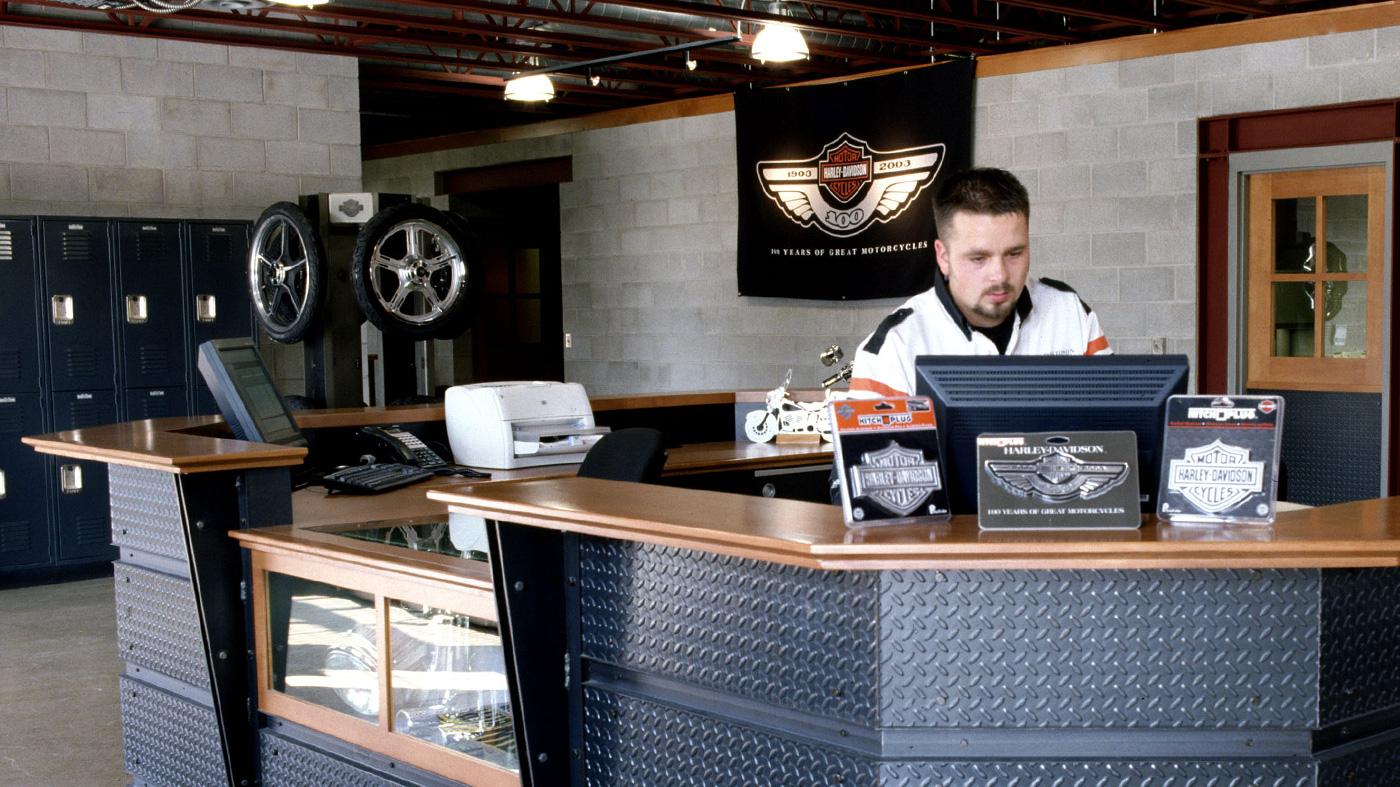 Dealer Representative Looking at Monitor