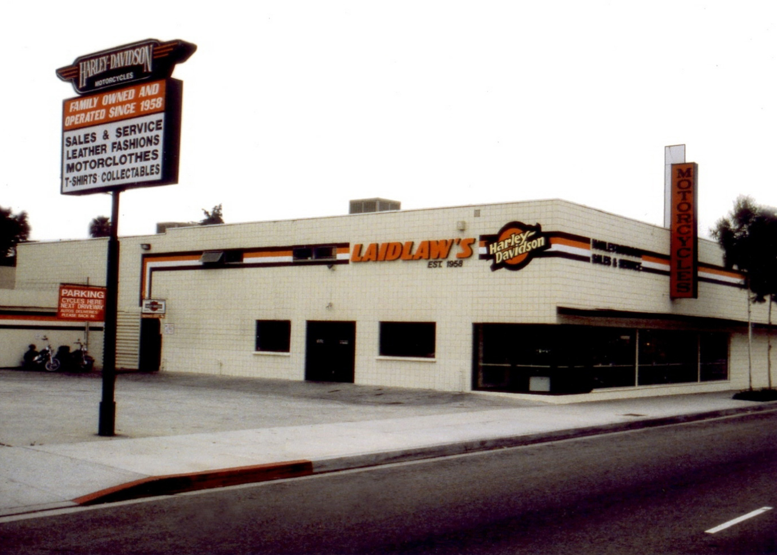 A vintage color photograph of Laidlaw’s dealership exterior.