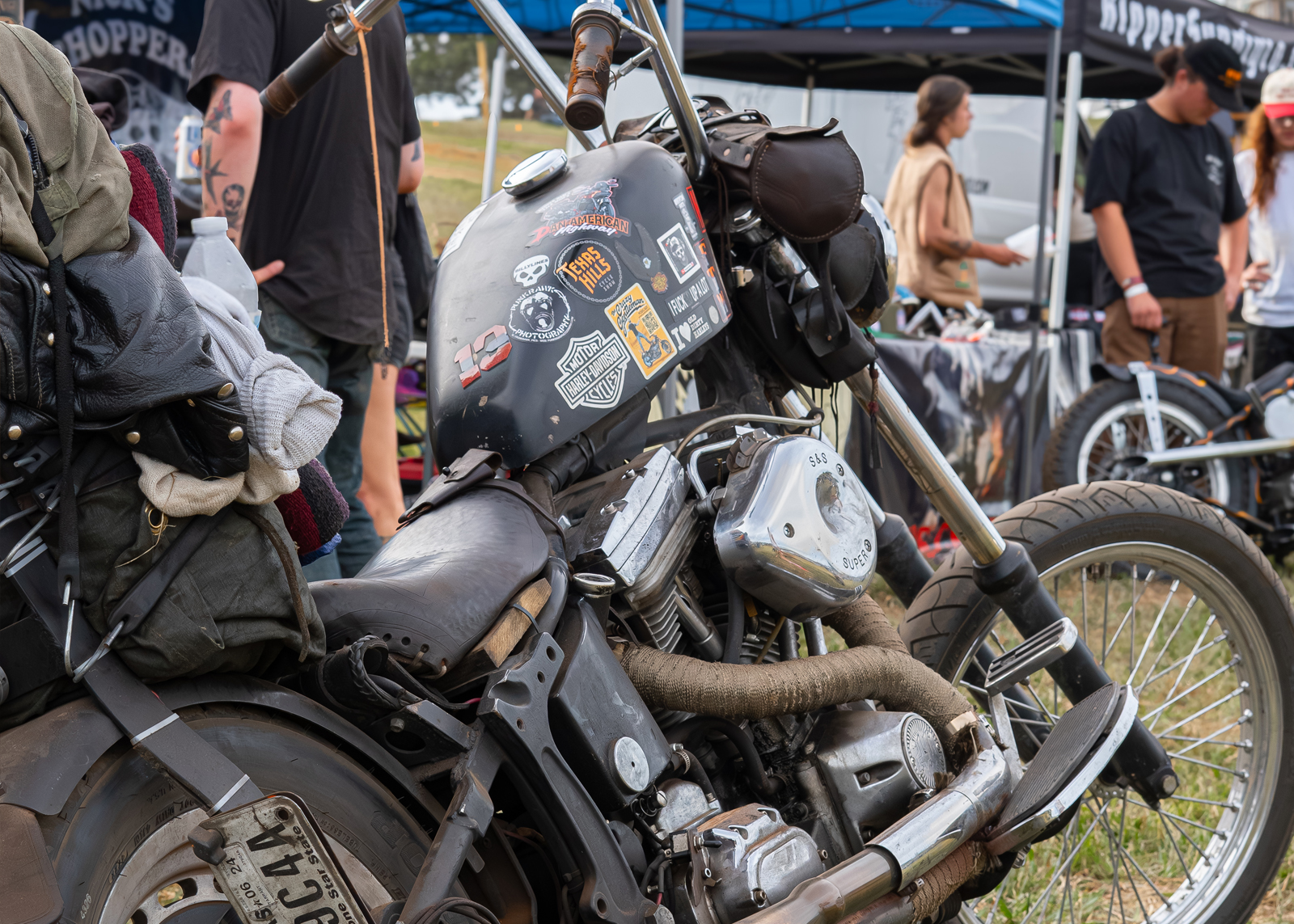 Black Harley with serveral stickers on the tank