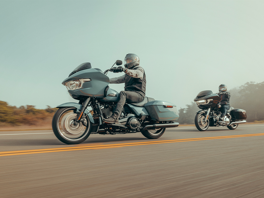 Two motorcyclist ride Road Glides on highway